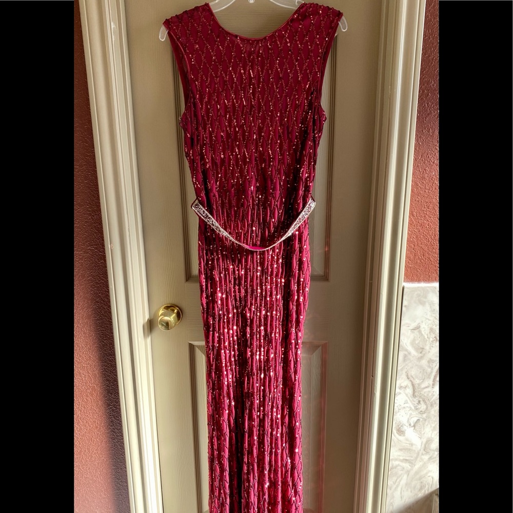 Miss Kim red lace gown in a size XL. Slightly new Dress was only worn One time.
